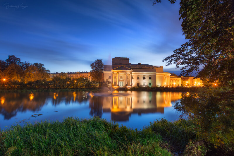 Illuminated Building by Lake
