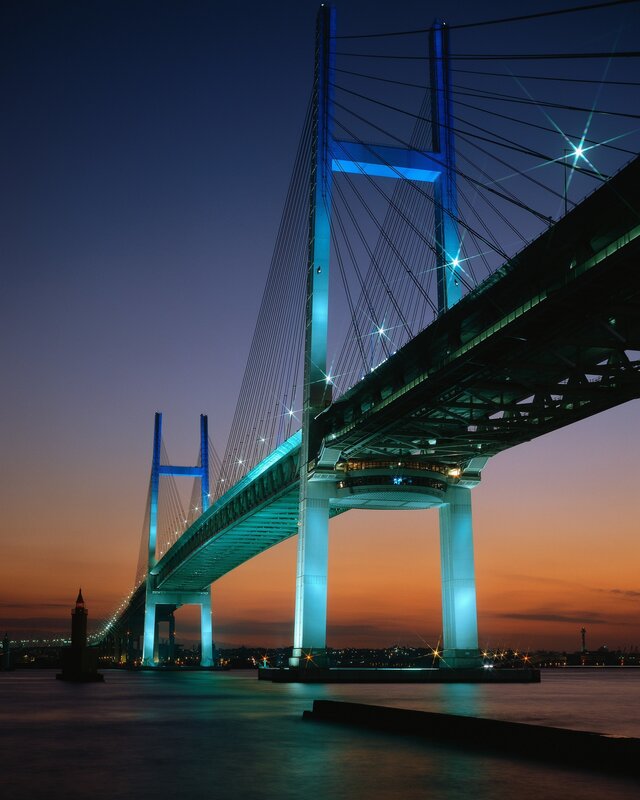 illuminated cable-stayed bridge at dusk