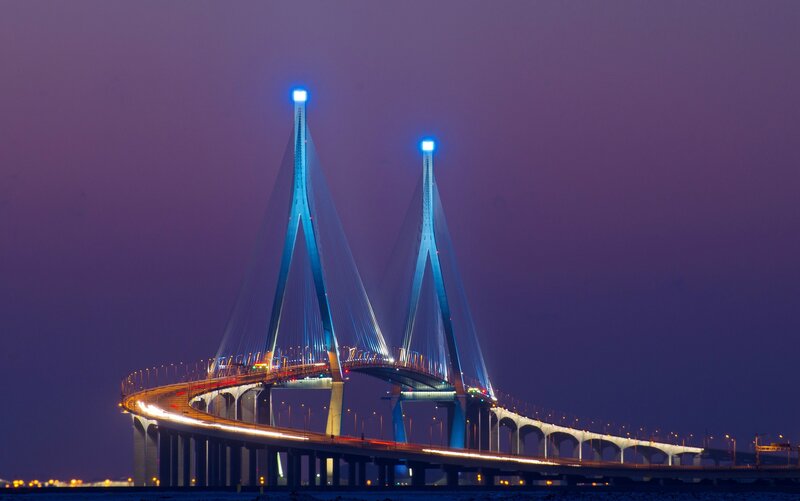 illuminated cable-stayed bridge at dusk