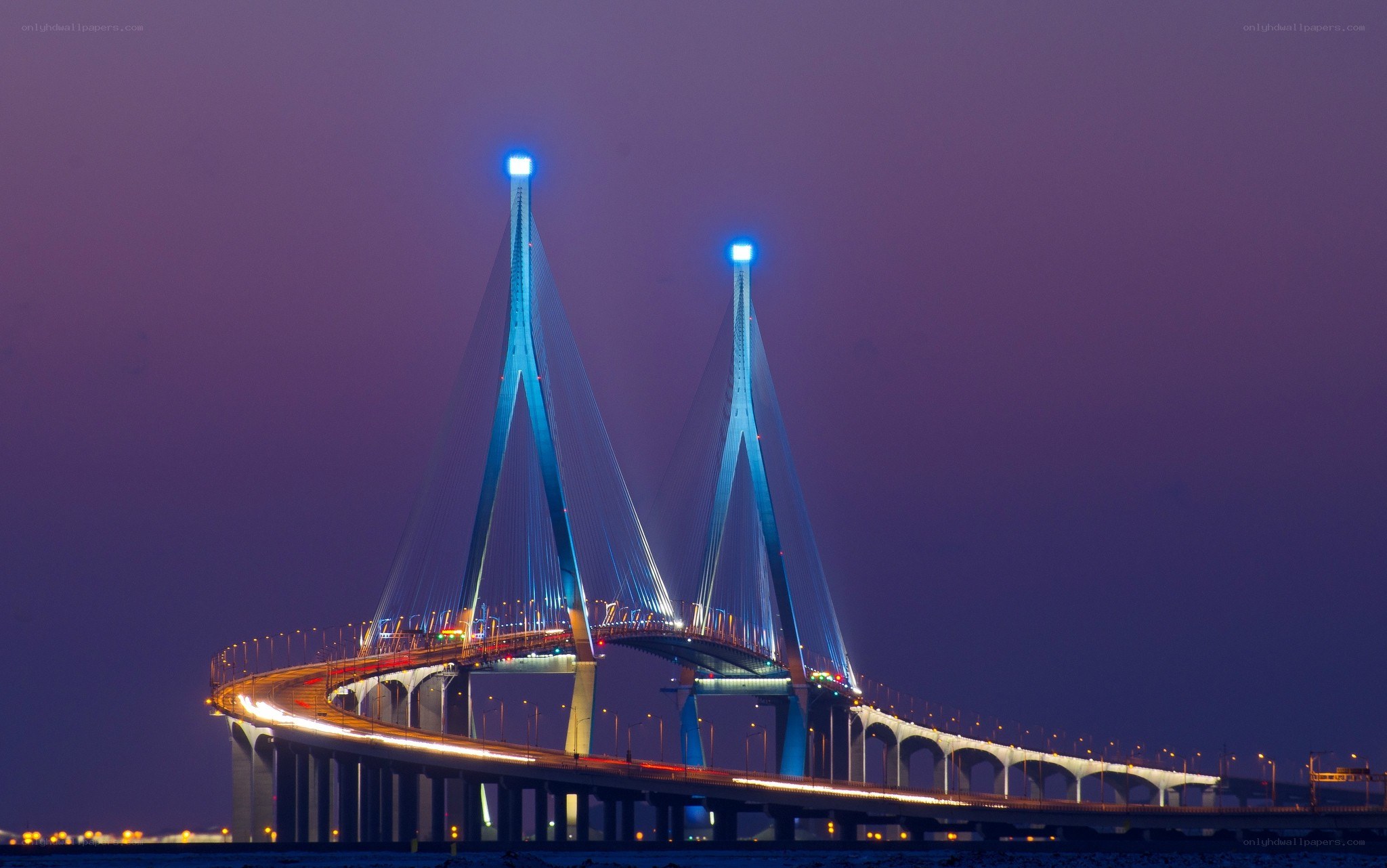 illuminated cable-stayed bridge at dusk