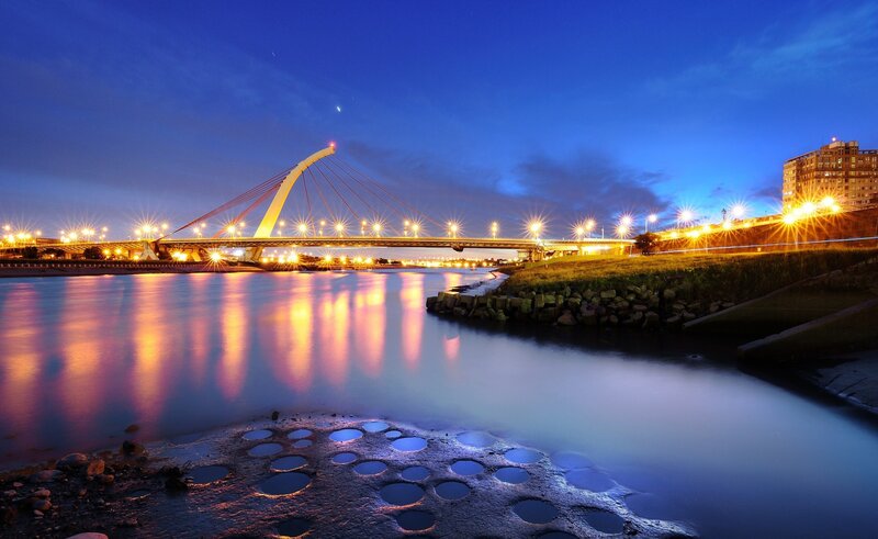 Illuminated Cable-stayed Bridge — Blue, Serene, Night, Photograph, River, City Lights