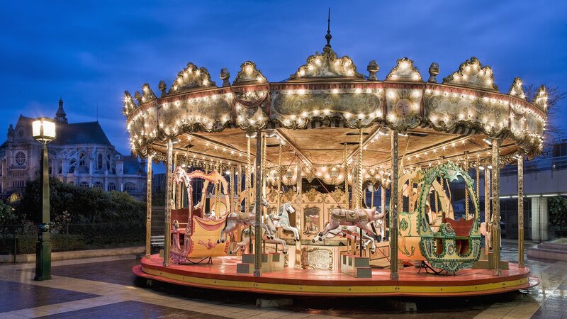 Illuminated carousel at dusk
