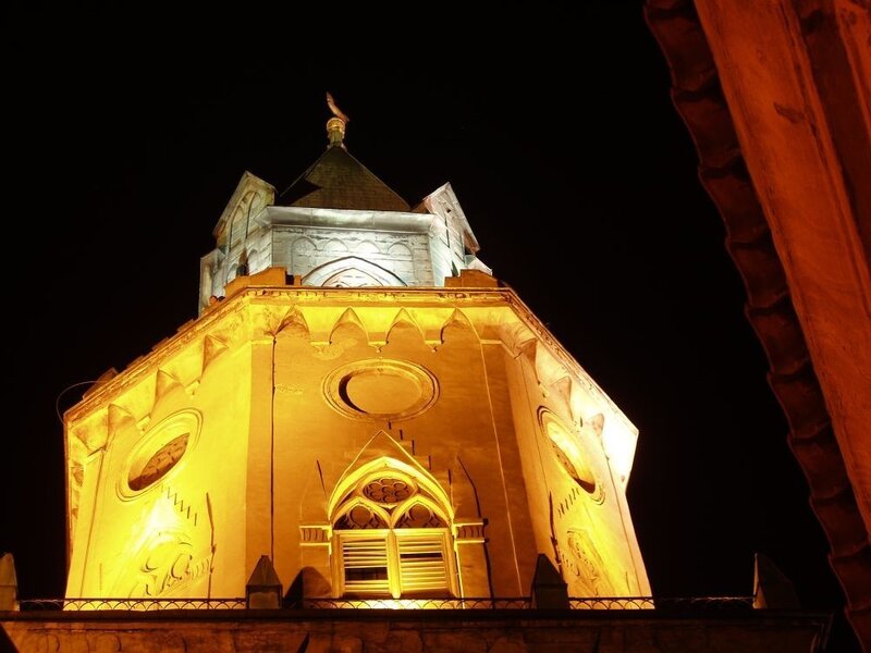 illuminated church tower at night