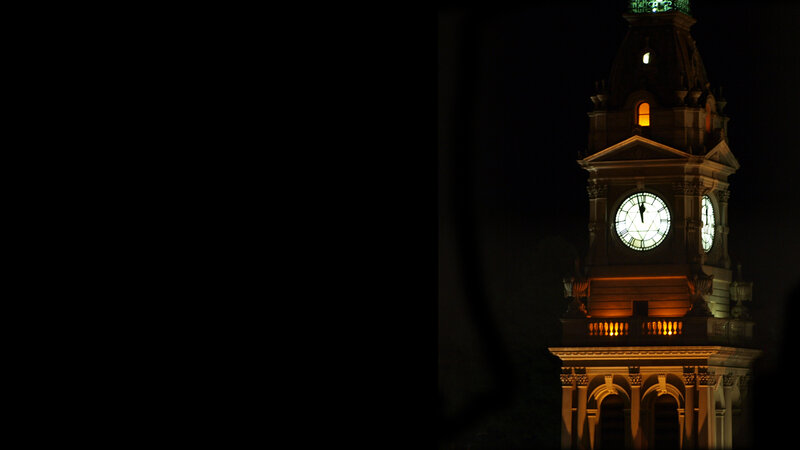illuminated clock tower at night