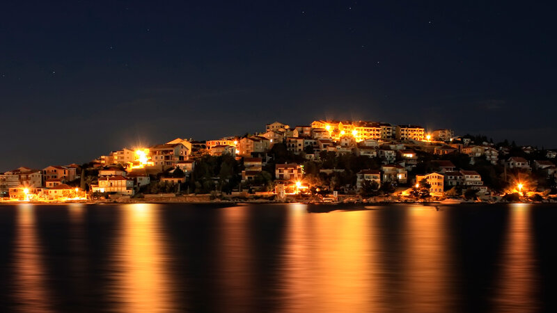 Illuminated Coastal Town — Black