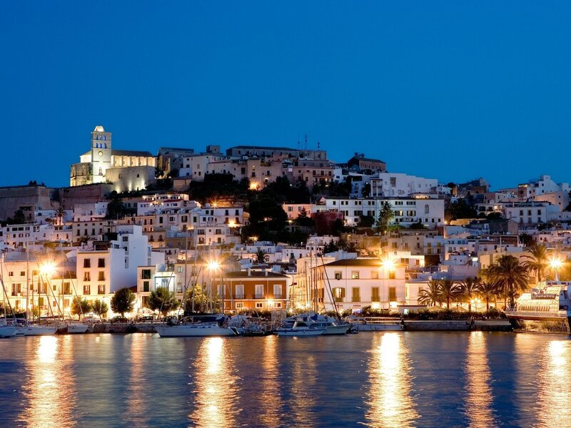 Illuminated Coastal Town — Blue, Serene
