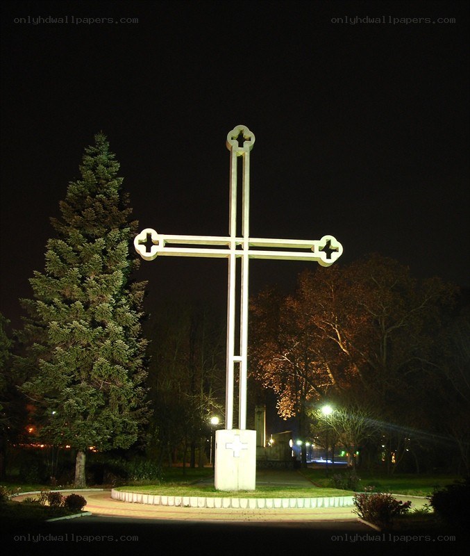illuminated cross at night