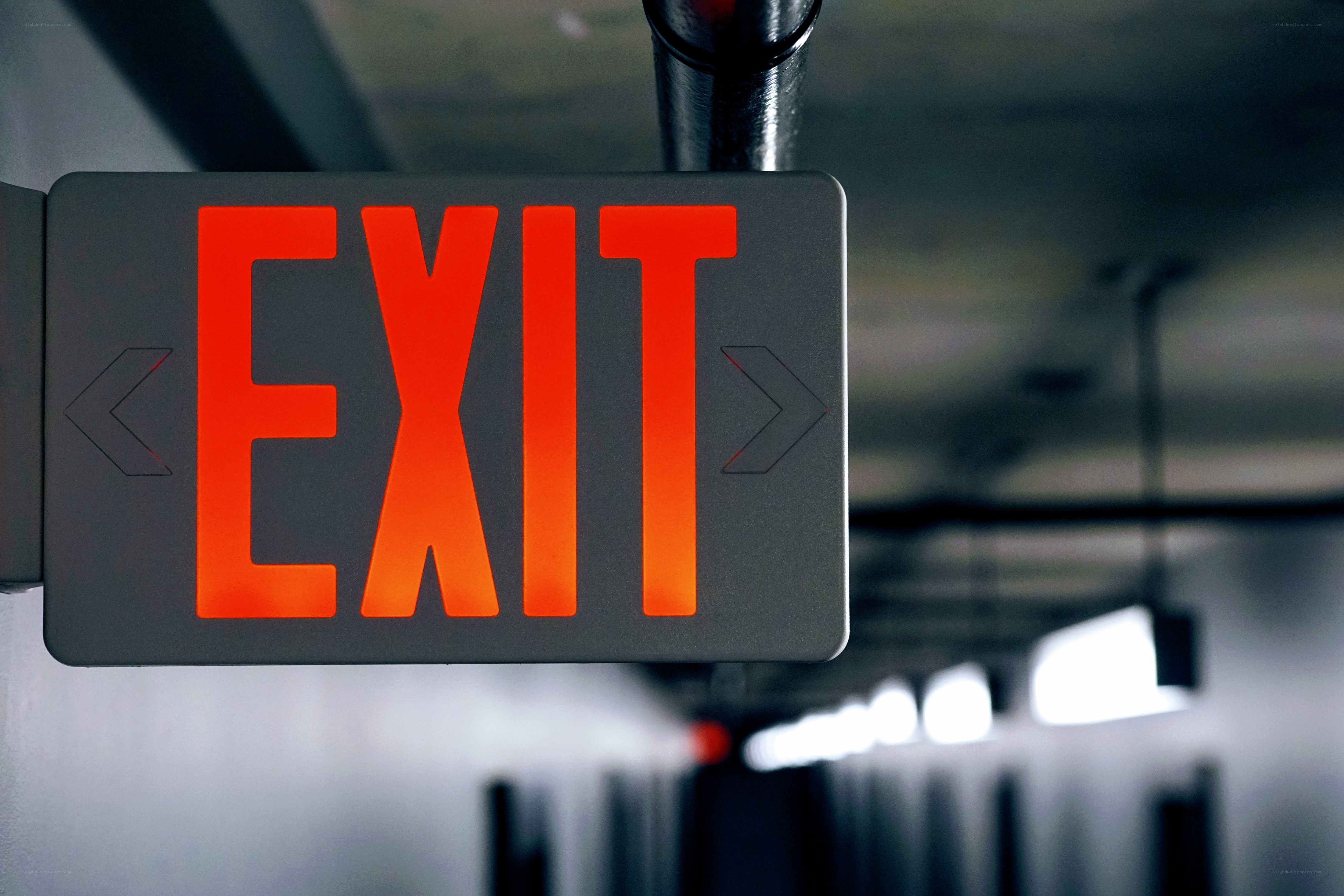 illuminated exit sign in hallway