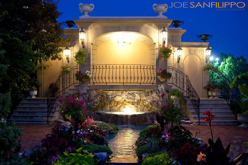 Illuminated garden fountain at dusk