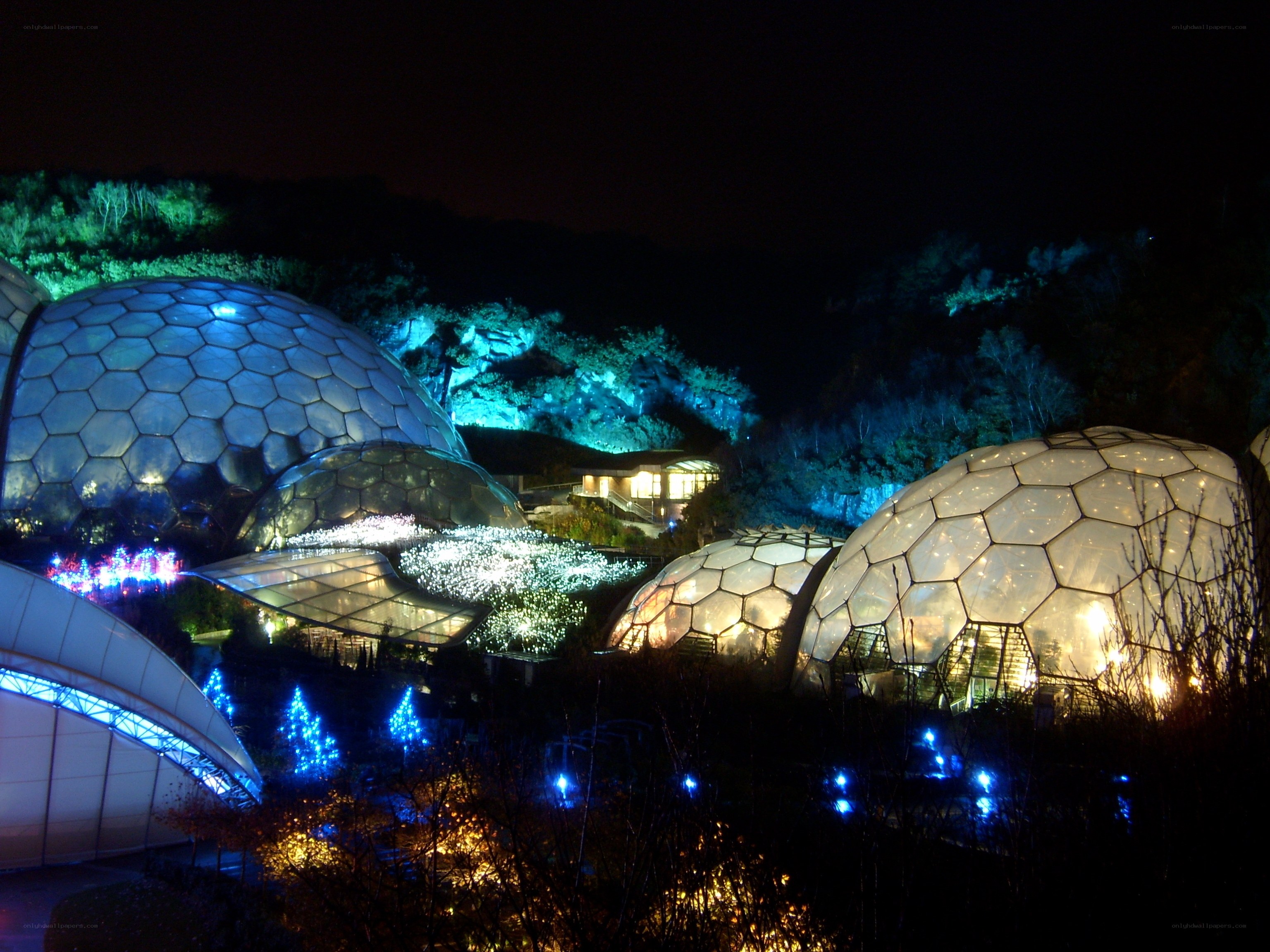 illuminated geodesic domes at night