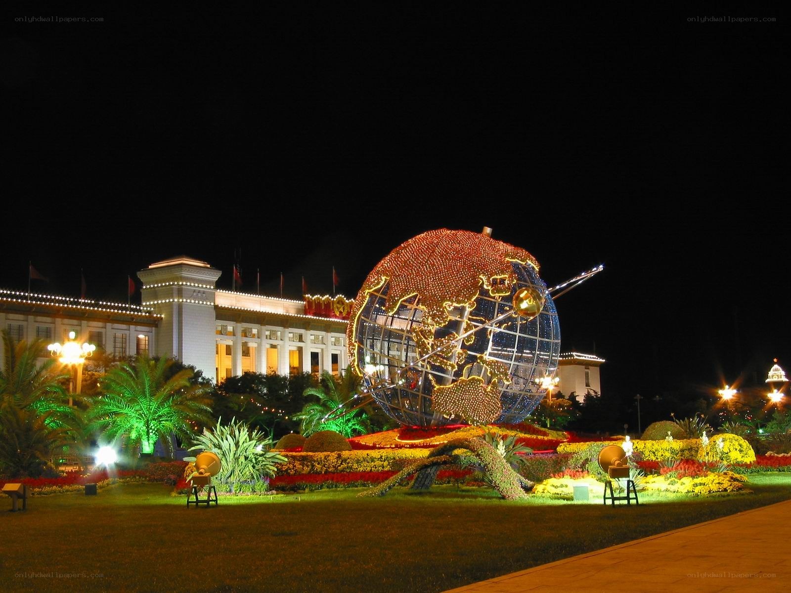 illuminated globe sculpture at night