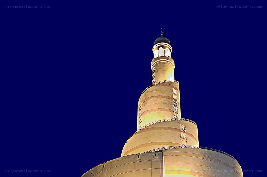 illuminated minaret at night