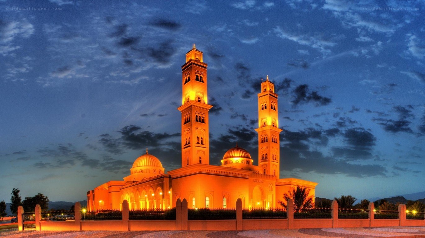 illuminated mosque at dusk
