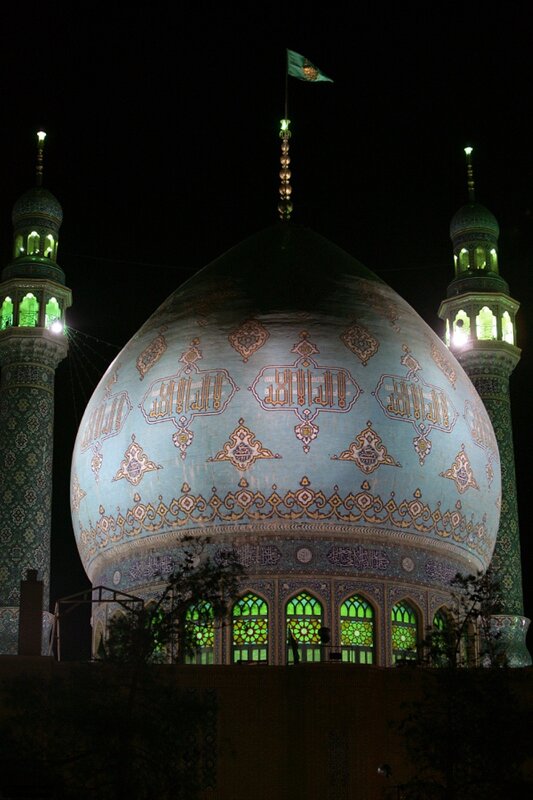 illuminated mosque dome at night