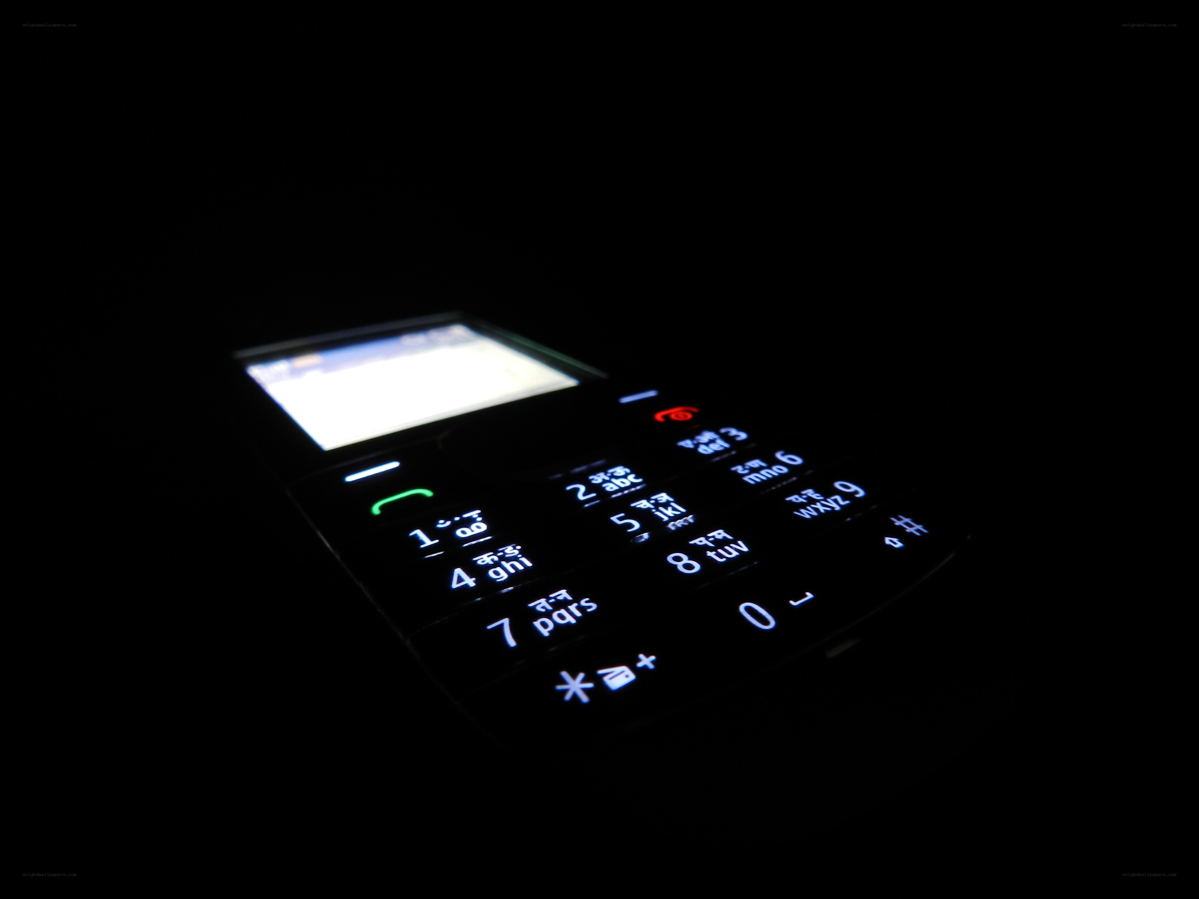 illuminated phone keypad in dark