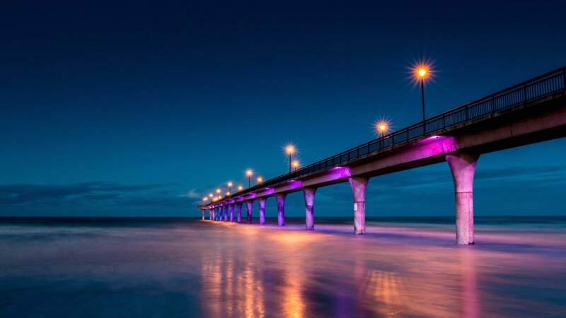 Illuminated Pier at Night — Blue