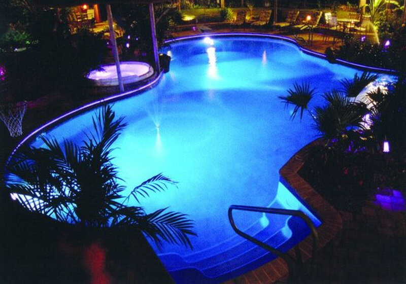 Illuminated Pool at Night — Blue, Serene, Photograph, Plants