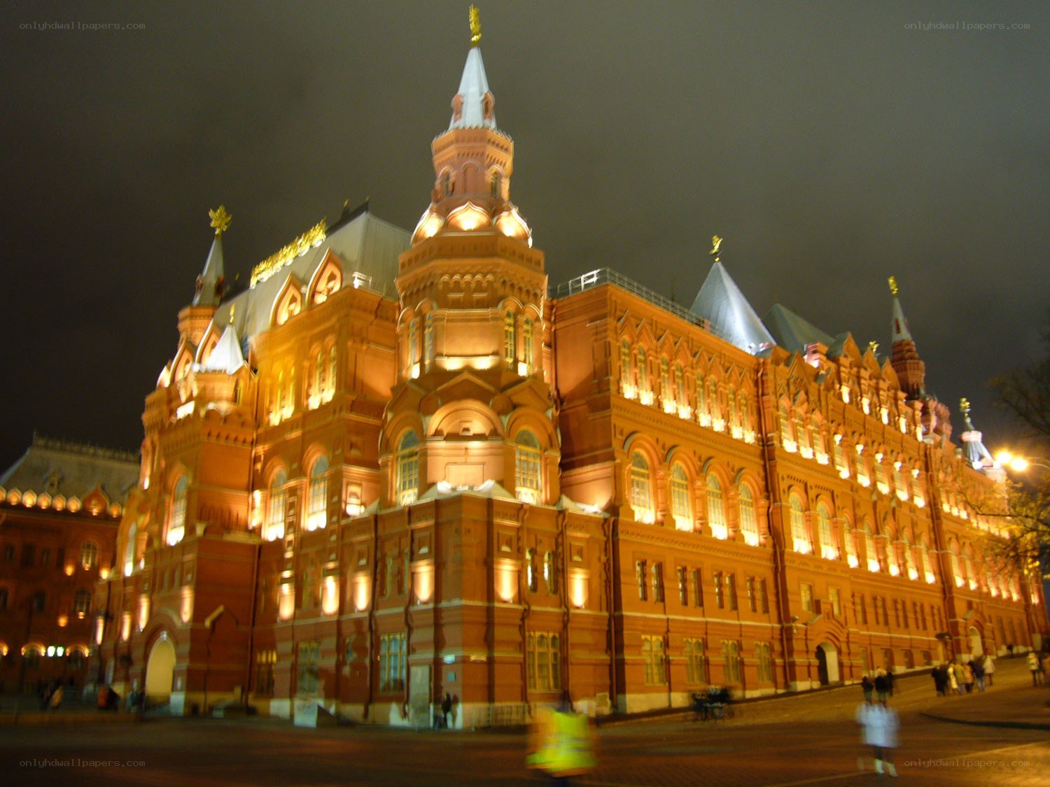 Illuminated red brick building at night