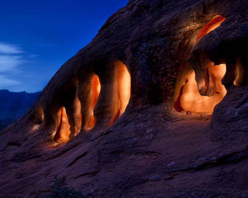 Illuminated rock formations at dusk