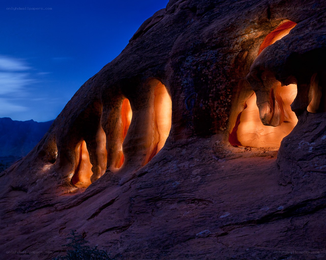 Illuminated rock formations at dusk