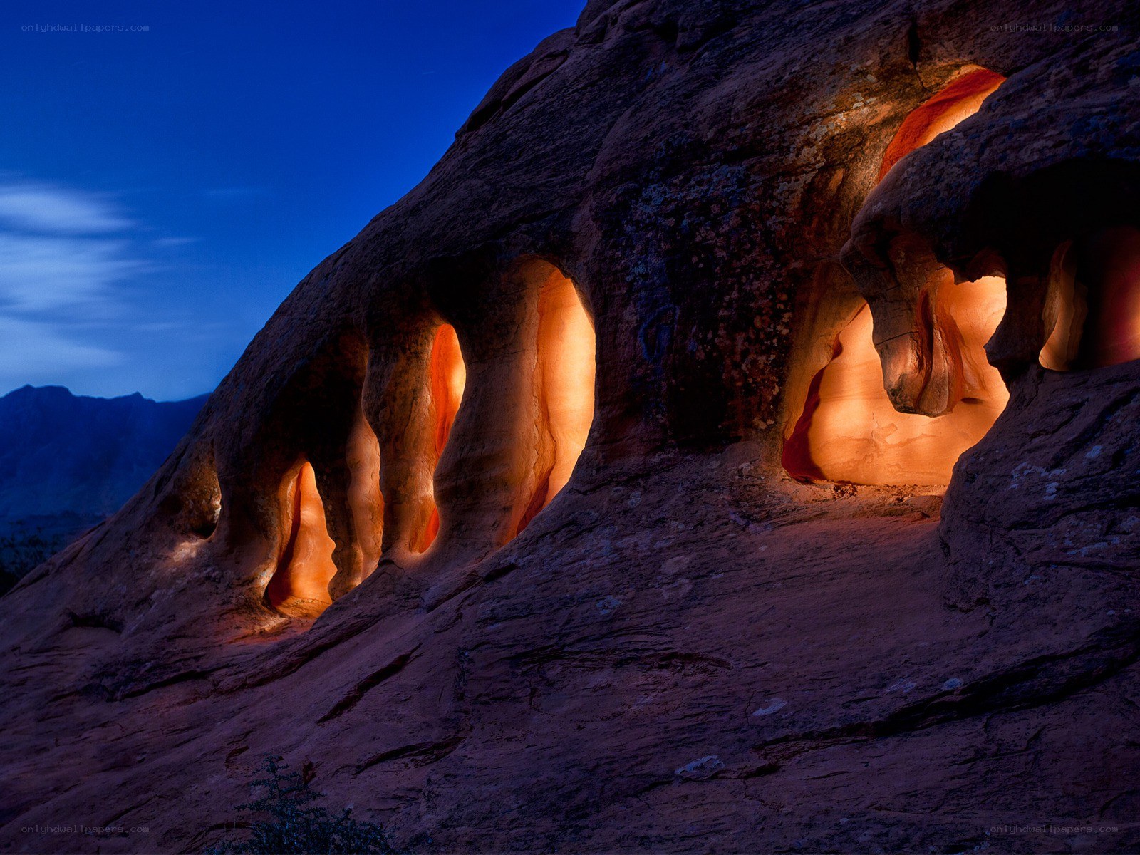Illuminated rock formations at dusk