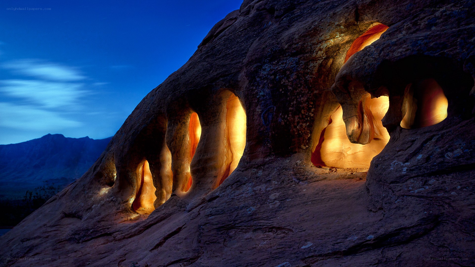 Illuminated rock formations at dusk