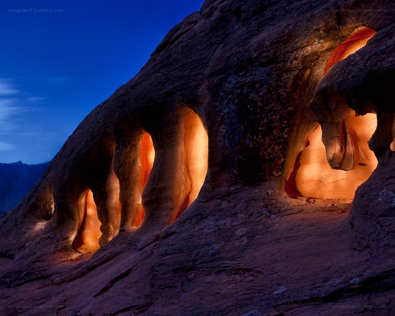 Illuminated rock formations at dusk
