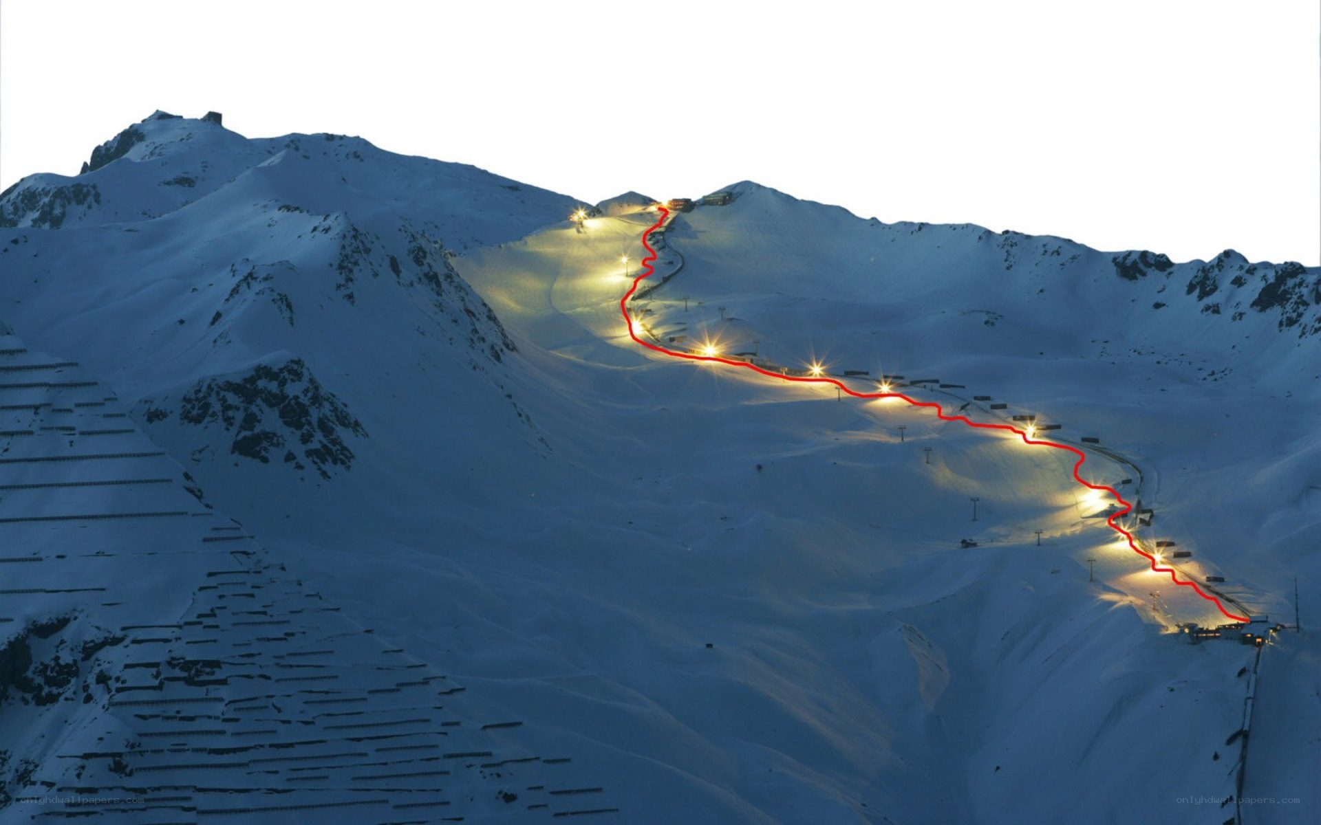 illuminated ski slope at dusk