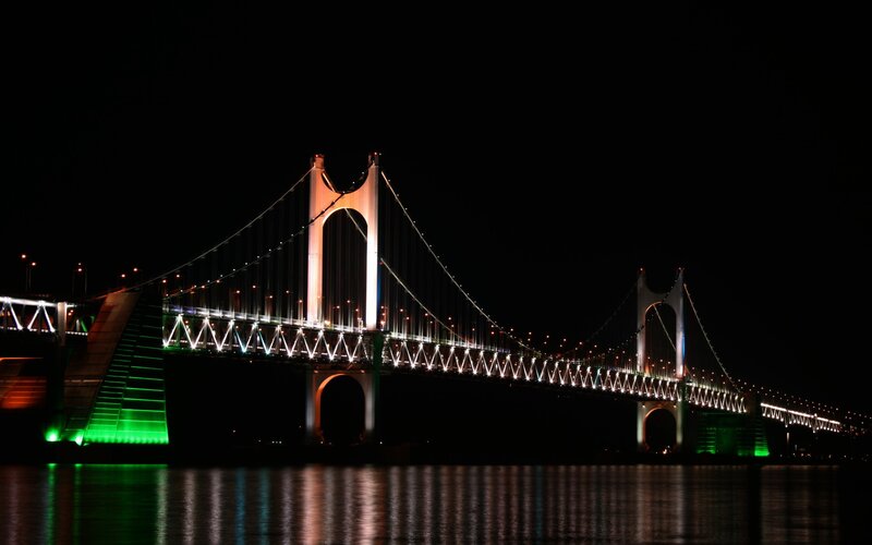 Illuminated Suspension Bridge — Black, Dramatic, Night, Photograph