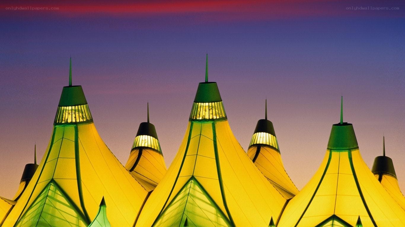 illuminated tent structures at dusk