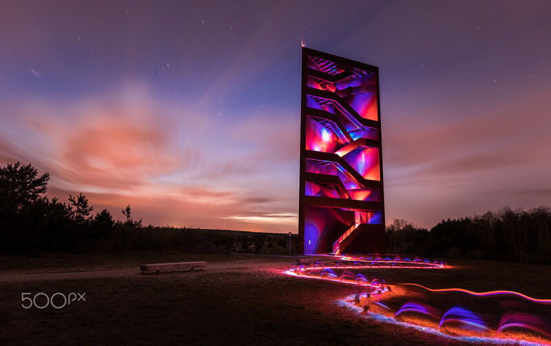 Illuminated Tower at Dusk — Purple