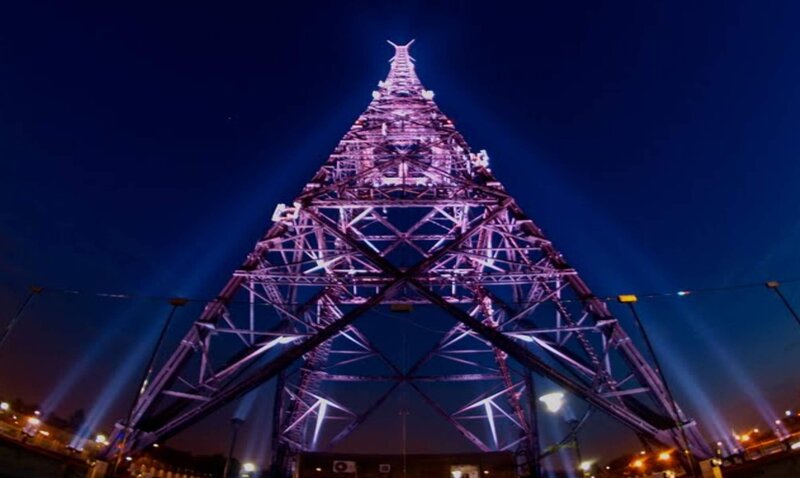 Illuminated Tower at Night — Purple