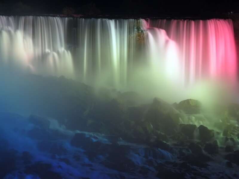 Illuminated Waterfall at Night — Pink