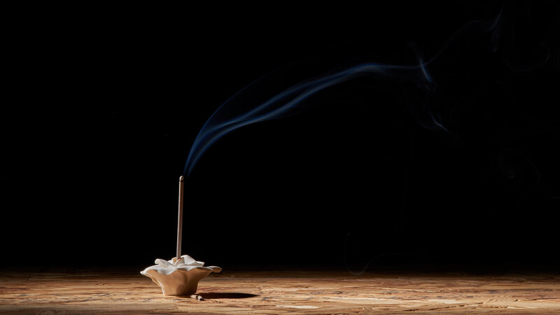 Incense Stick on Wooden Surface