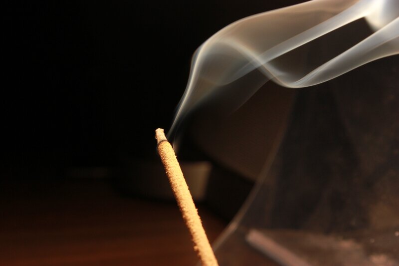 Incense stick with rising smoke