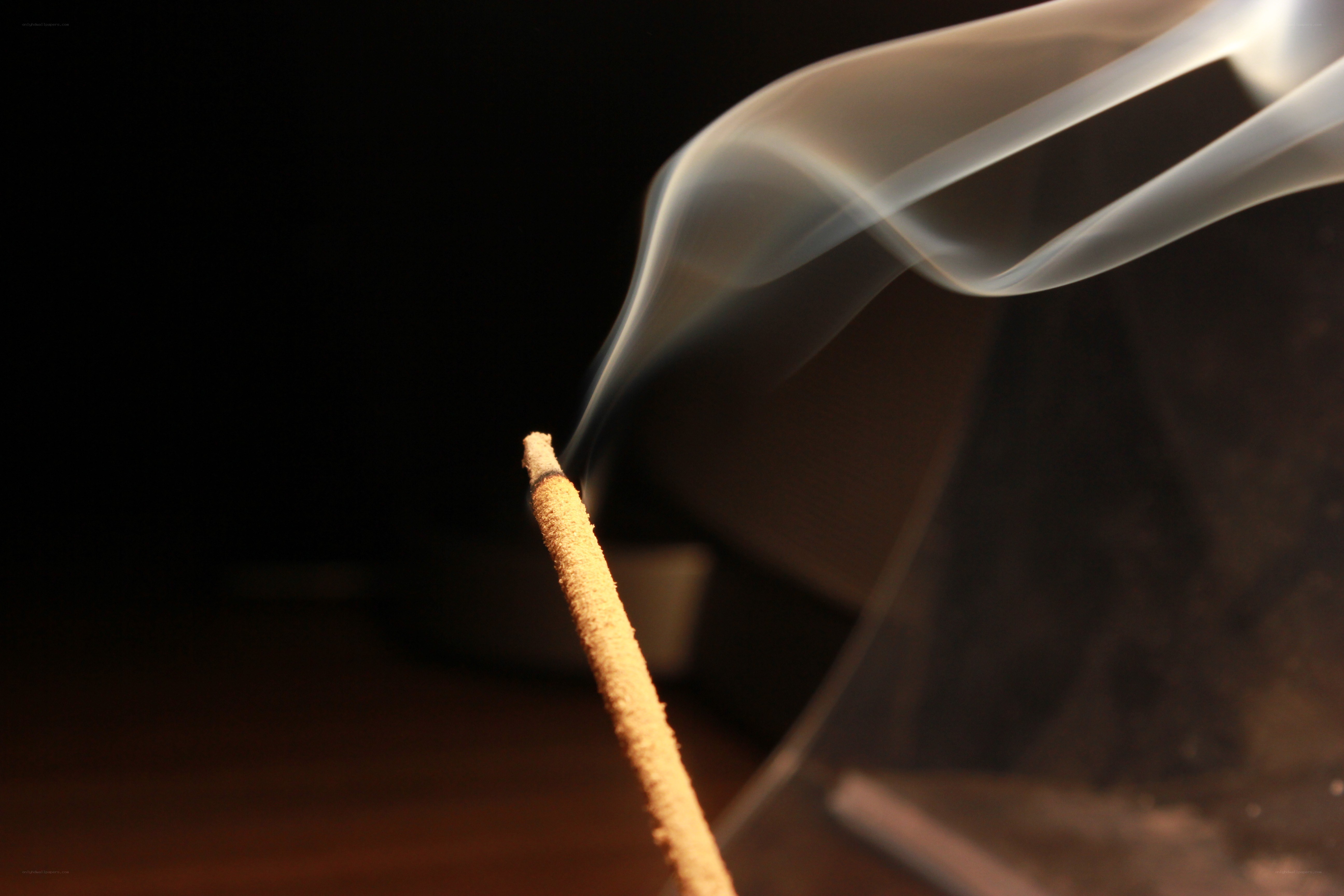 Incense stick with rising smoke