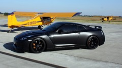 Aircraft black yellow cars