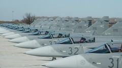 Aircraft parking military bomber flying Saab jets 