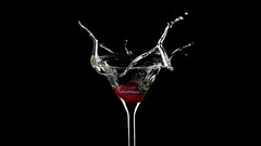 Alcohol black background Martini drinks splashes