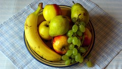 Apples grapes bananas pear fruits bowl table cloth