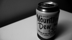 Black and white mountain dew Pop soda cans