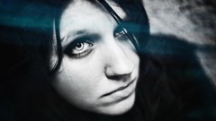 Black and white woman faces black and blue