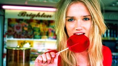 Blondes woman lollipops licking