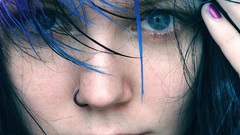 Blue woman faces purple hair pierced lips