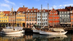 Boats Denmark houses piers district copenhagen blue skies 