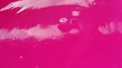Bright pink surface glossy texture