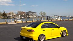 Car Mitsubishi Lancer Evo X yellow cars Harbor vehicle