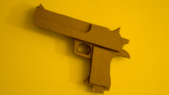 Cardboard yellow background Guns
