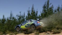 Cars jumping dust rally