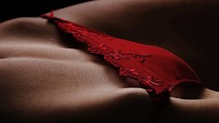 Close-up lying down red panties pubis